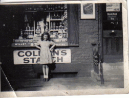 [girl in front of shop]