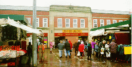 [market entrance between outdoor stalls]