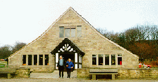 [Great House Barn with large slanting roof]