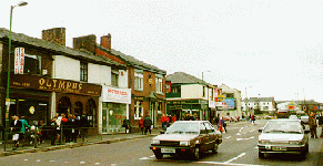 [Looking west up street]