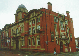 [Red brick building]
