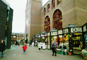 [shop lined alleyway]