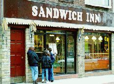 [Outside the Sandwich Inn]