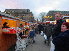 [market stalls and interested people]
