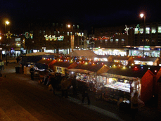[lights and market stalls from town hall steps]